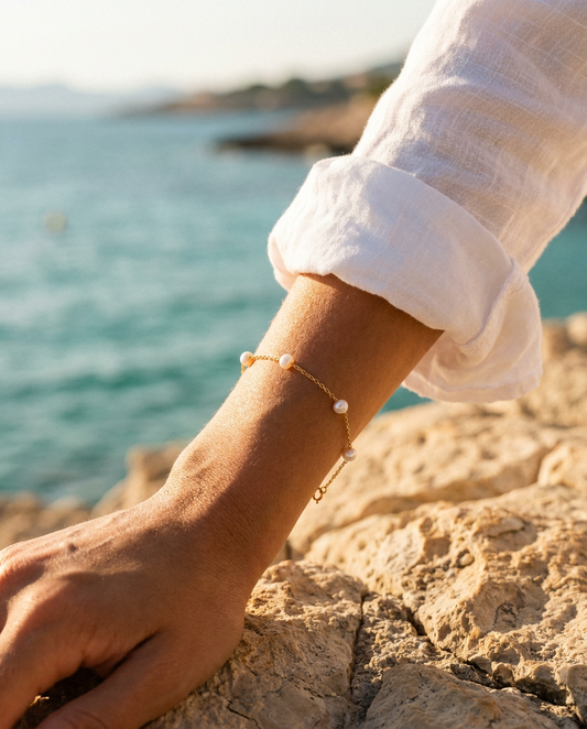 Céleste Pearl Bracelet 14K Gold worn on wrist, coastal editorial