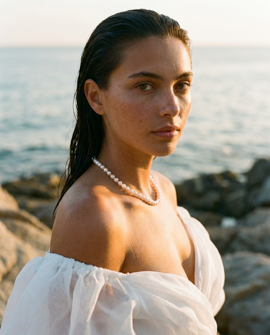 The Classic Strand 14K Gold worn in white organza at golden hour
