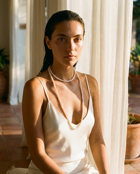 The Opera Strand worn doubled in ivory silk, villa editorial
