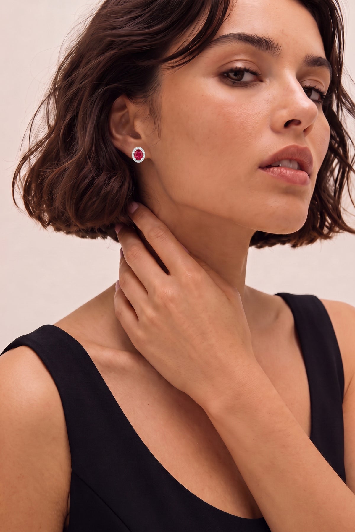 Oval Ruby and Diamond Halo Stud Earrings on model