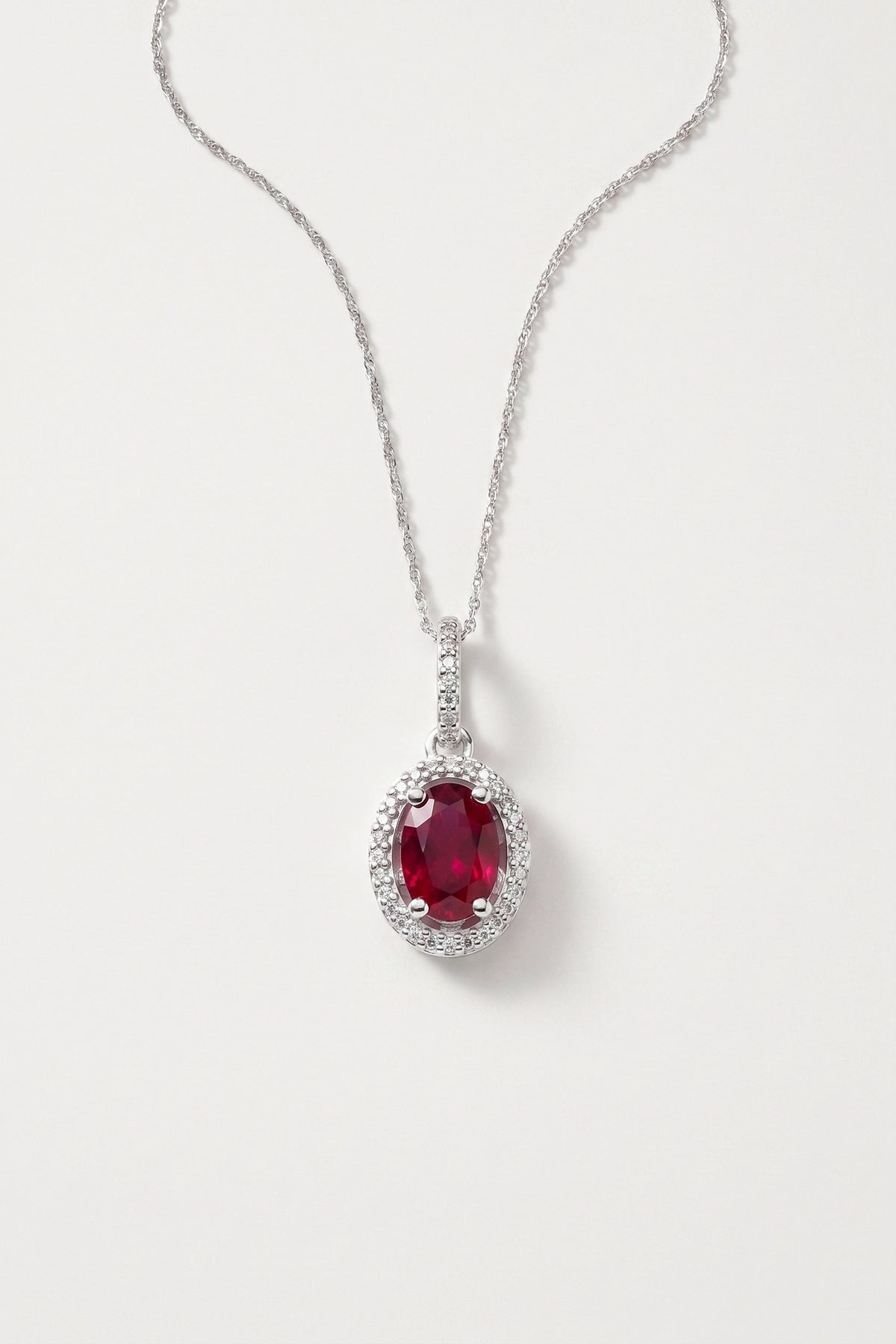 Oval Ruby and Diamond Halo Pendant Necklace