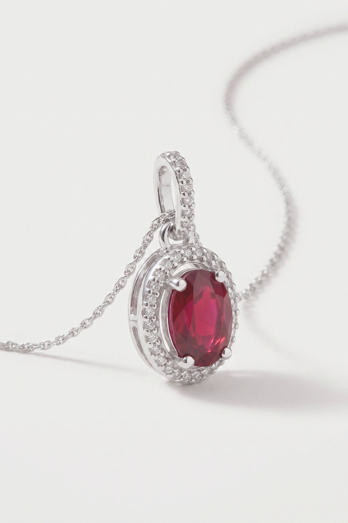 Oval Ruby and Diamond Halo Pendant Necklace detail
